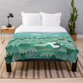 Soft and cuddly plush blanket featuring a cute forest creature design