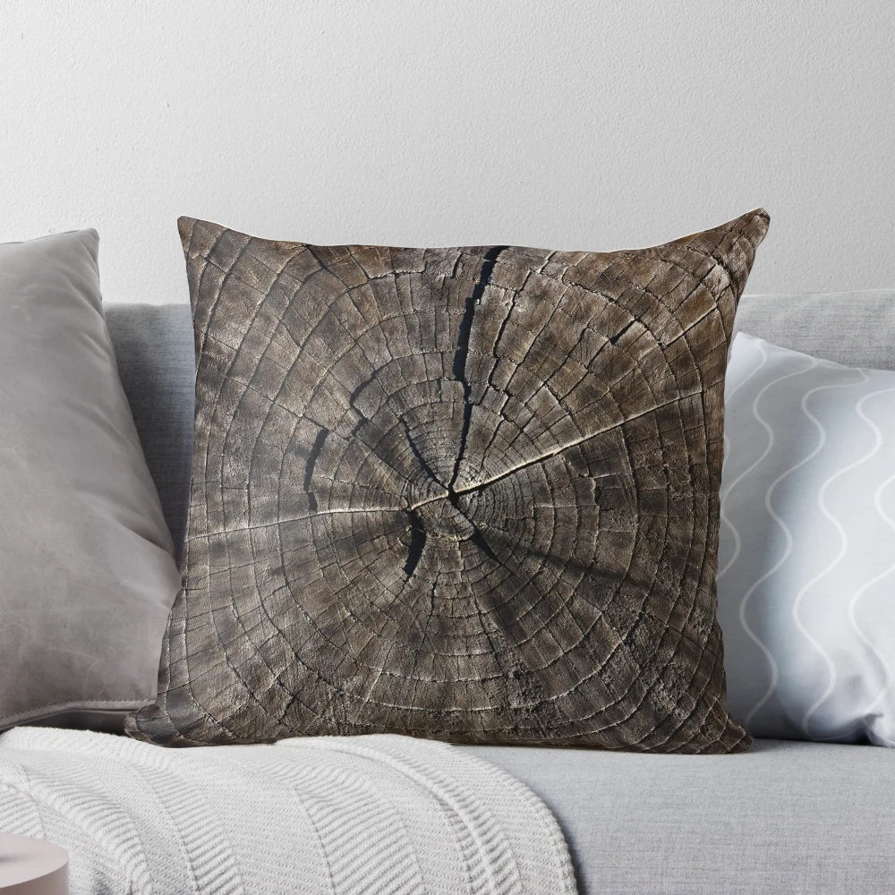 Close-up image of a pillow with a tree rings pattern, showcasing the natural beauty of wood