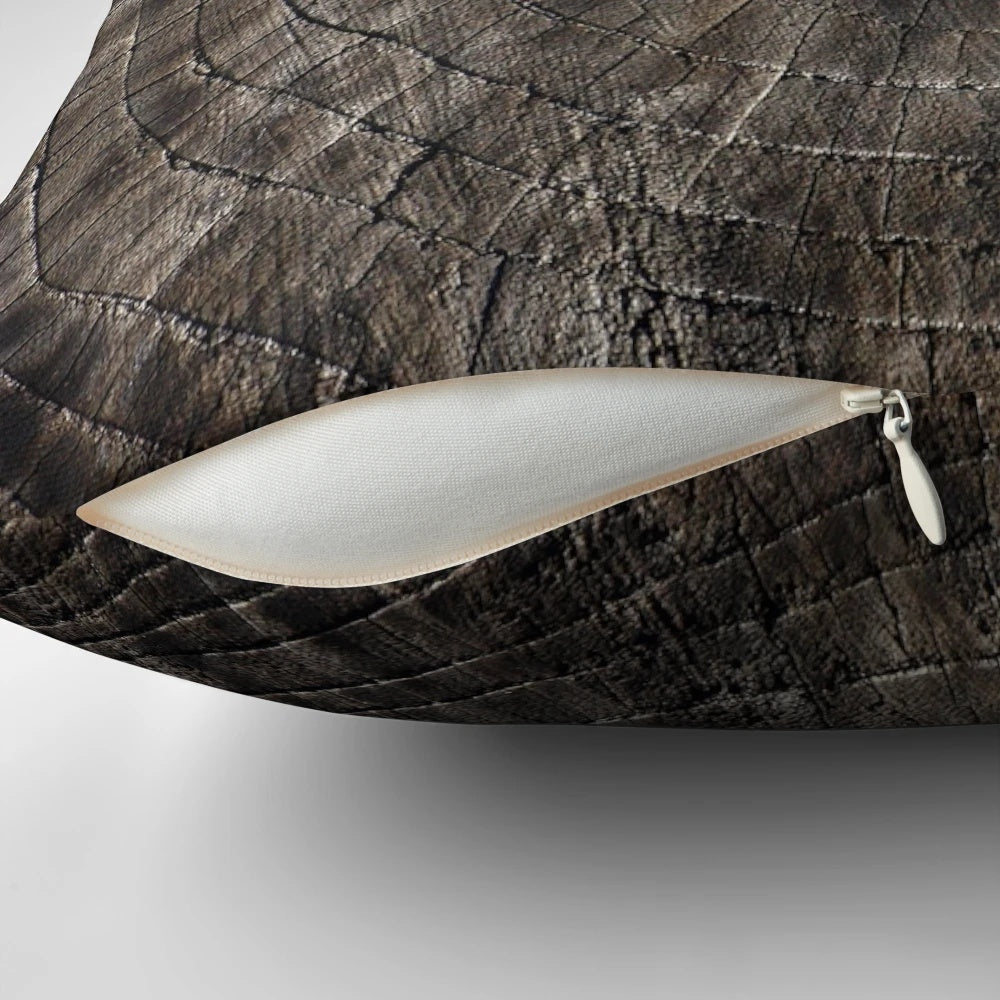 Close-up image of a pillow with a tree rings pattern, showcasing the natural beauty of wood