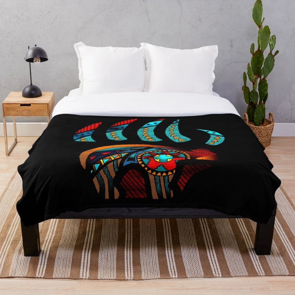 Plush blanket with bear claw inspired native american pattern