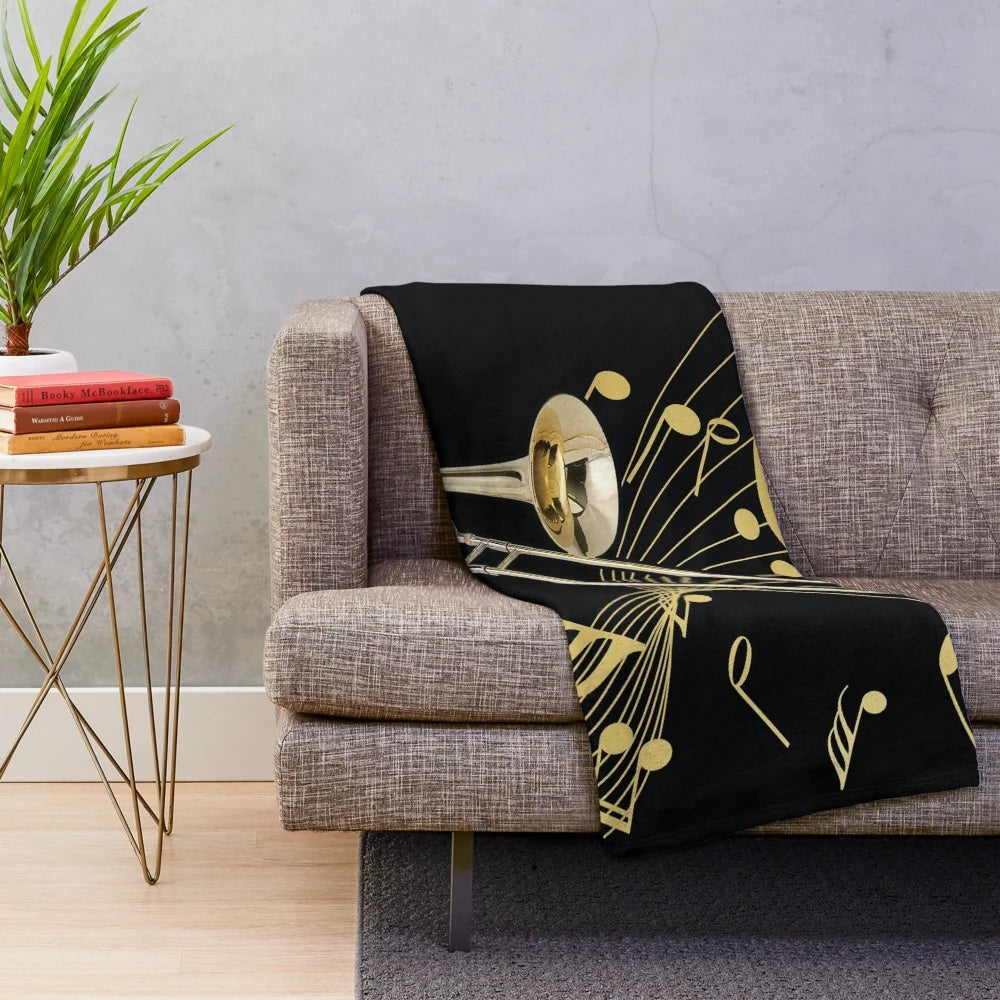 Trombone and music note patterned plush blanket