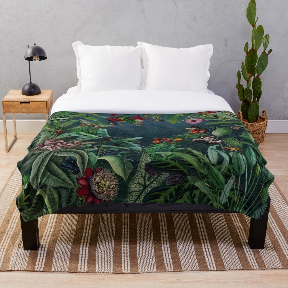 Lush tropical foliage and botanical elements on a plush blanket