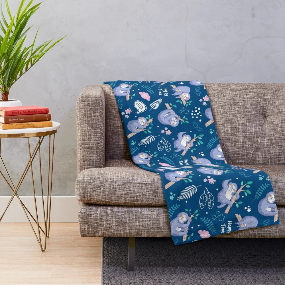 Soft and cozy plush blanket with a tropical sloth pattern design