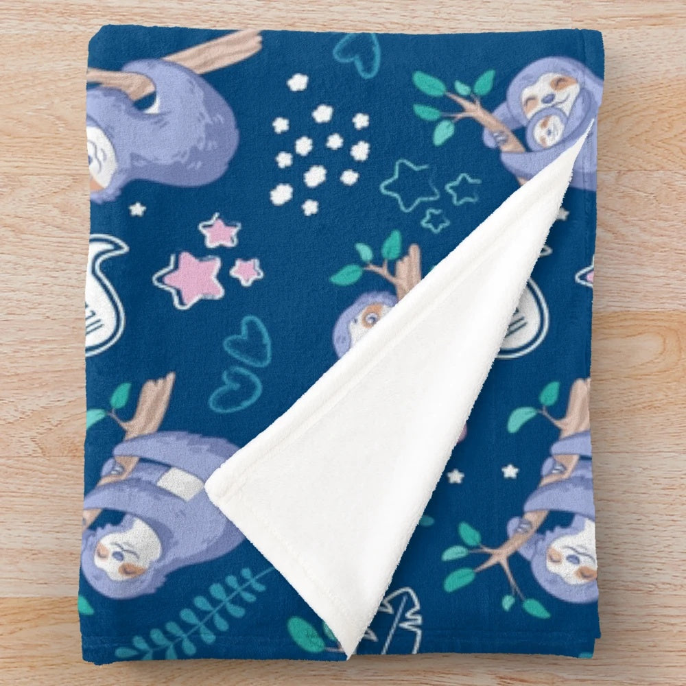 Soft and cozy plush blanket with a tropical sloth pattern design