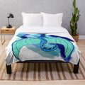 Tsunami-inspired plush blanket featuring dragon designs