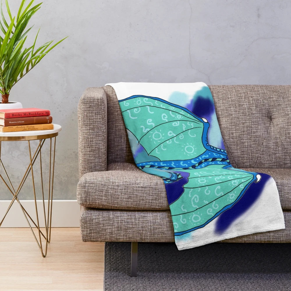 Tsunami-inspired plush blanket featuring dragon designs