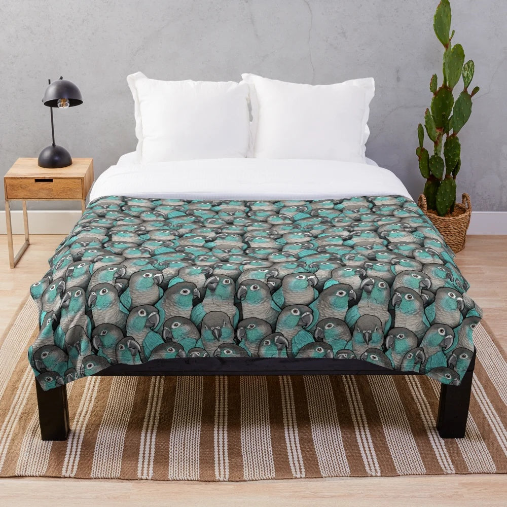 Turquoise plush blanket featuring a detailed cheeked conure bird design