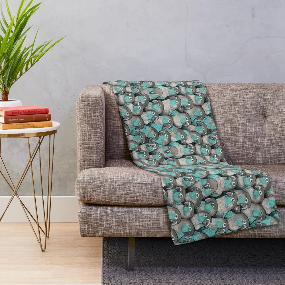 Turquoise plush blanket featuring a detailed cheeked conure bird design