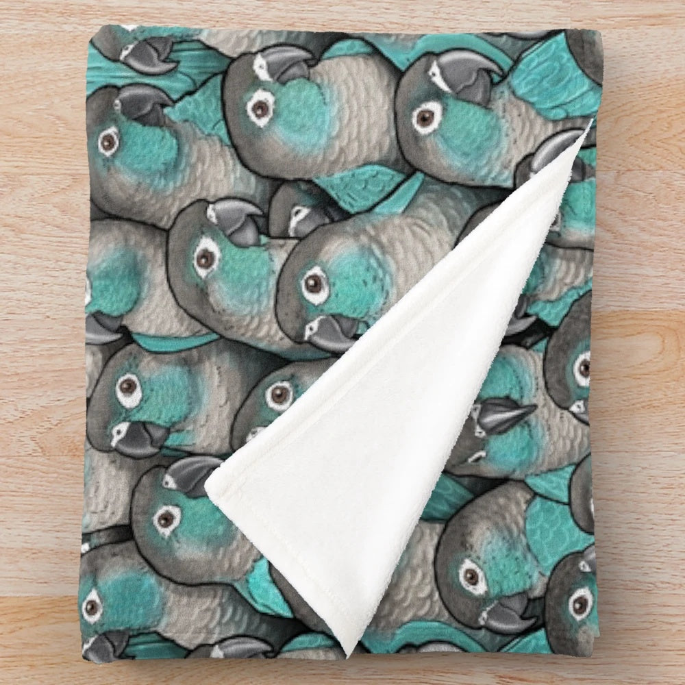 Turquoise plush blanket featuring a detailed cheeked conure bird design