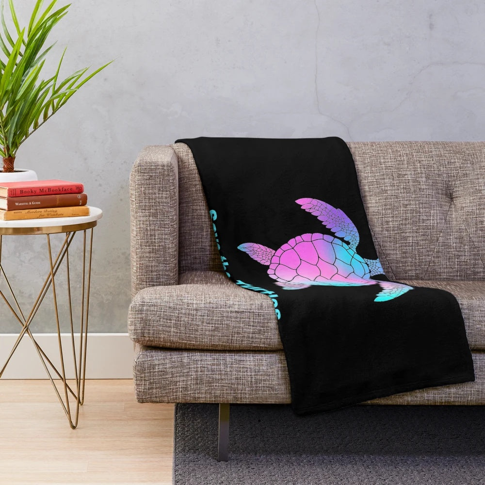 Soft and cuddly turtle plush blanket with a vibrant tie-dye pattern perfect for beach and summer vibes.