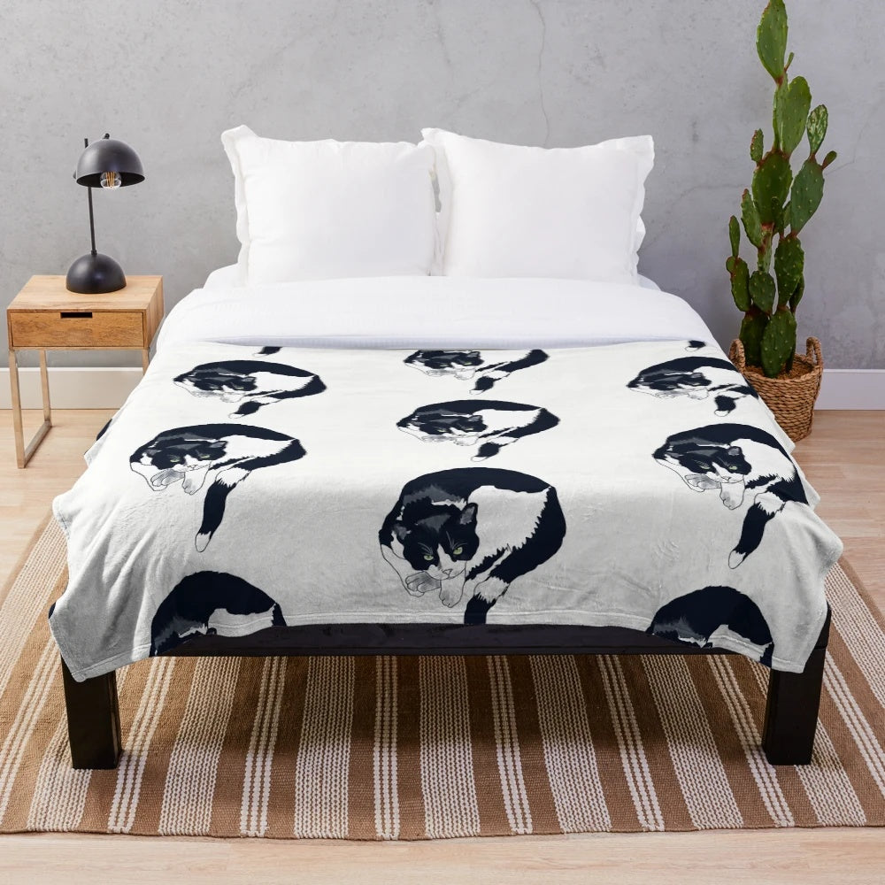 Soft, warm tuxedo cat plush blanket with black and white cat portrait