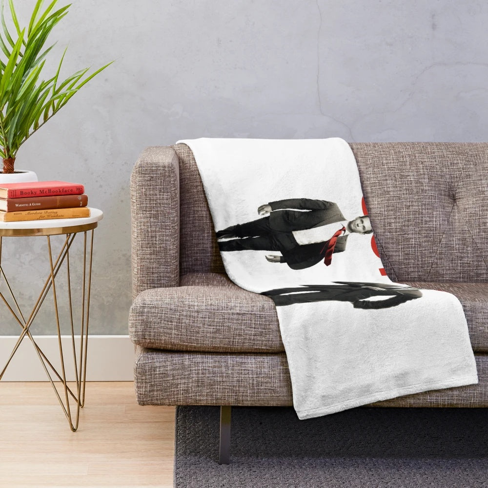 Tuxedo-inspired plush blanket with a minimal black and white design