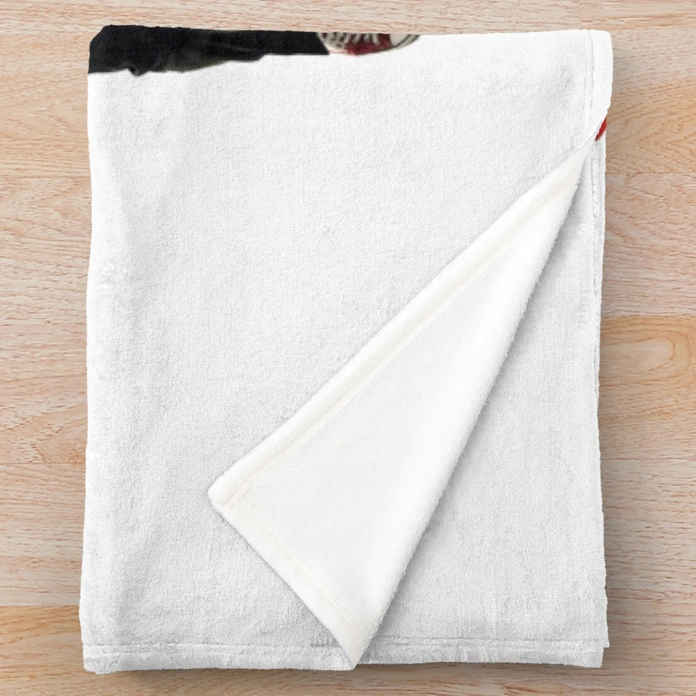 Tuxedo-inspired plush blanket with a minimal black and white design