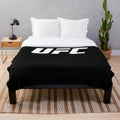 UFC-inspired plush blanket with fight imagery