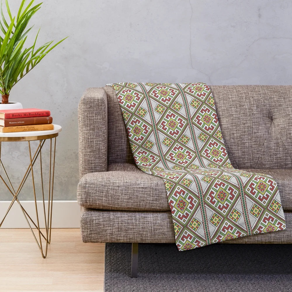 Plush blanket featuring vibrant Ukrainian embroidery design