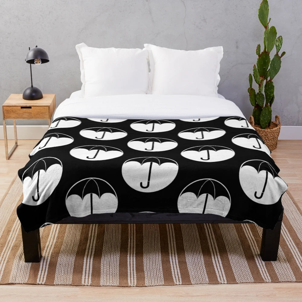 Soft and cozy plush blanket featuring The Umbrella Academy logo and design