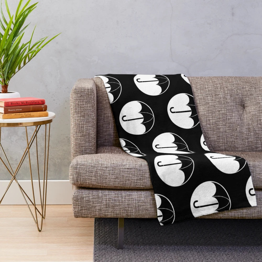 Soft and cozy plush blanket featuring The Umbrella Academy logo and design