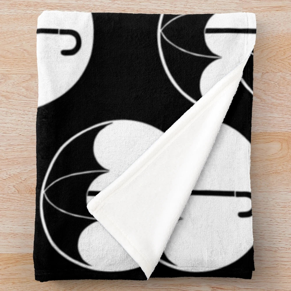 Soft and cozy plush blanket featuring The Umbrella Academy logo and design