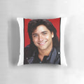 Soft, plush pillow featuring the likeness of the iconic "Full House" character, Uncle Jesse, played by actor John Stamos.