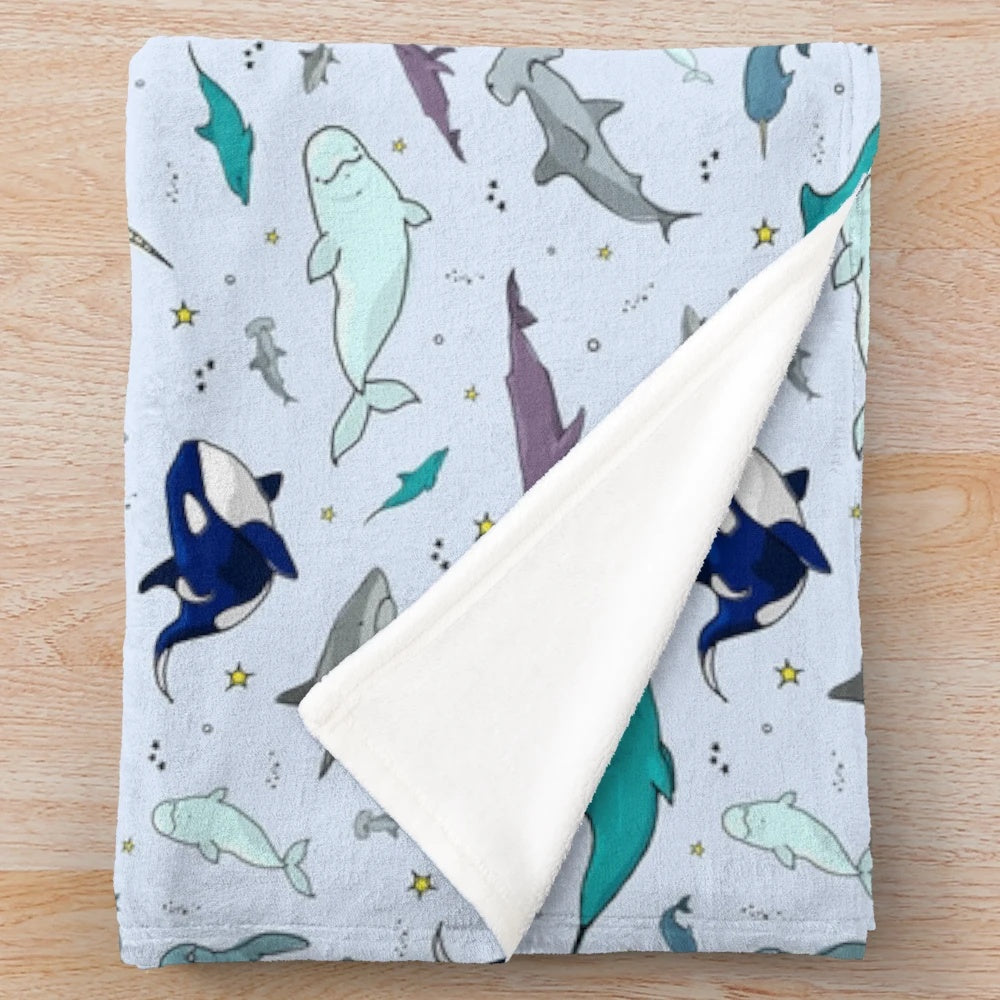 Soft and snuggly plush blanket featuring underwater sea life designs