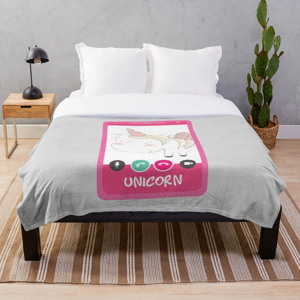 Cute and funny unicorn plush blanket with a smiling, pastel pink design