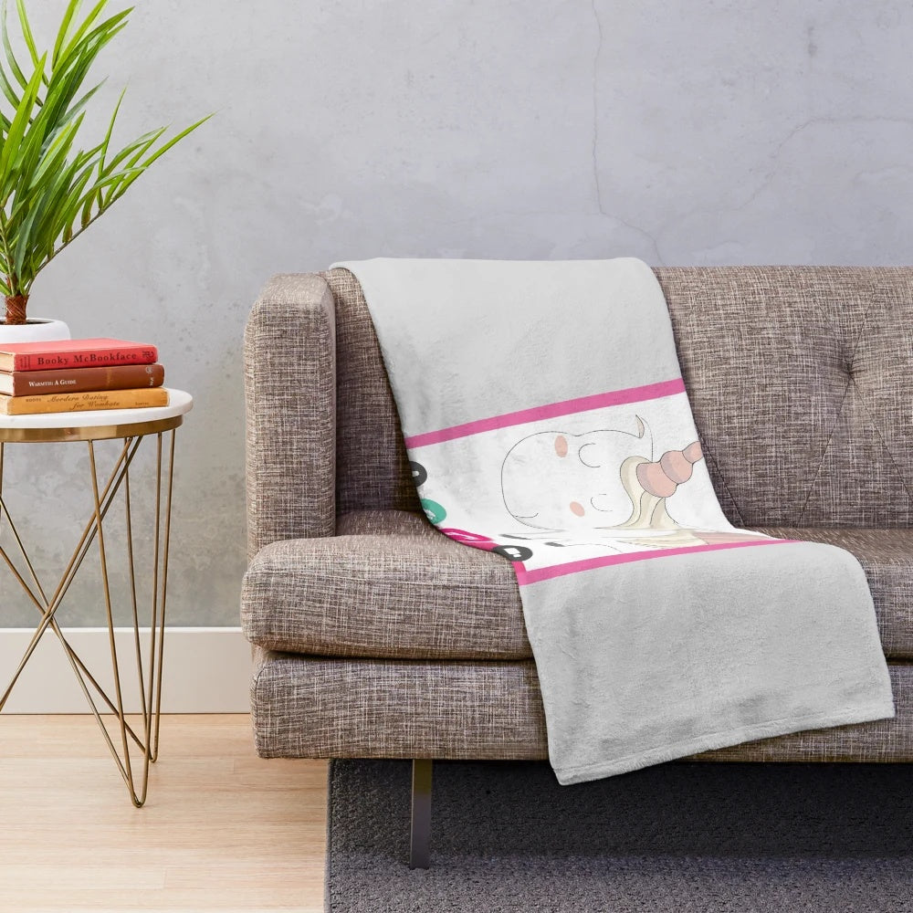 Cute and funny unicorn plush blanket with a smiling, pastel pink design