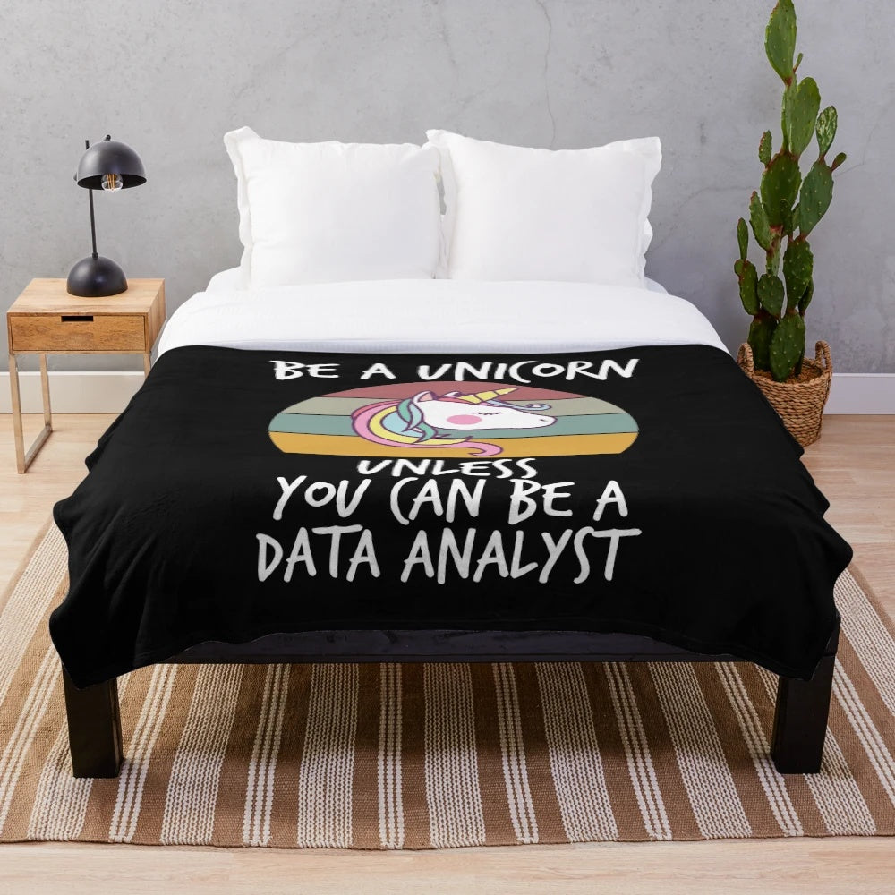Plush unicorn-themed blanket for data engineers and analysts