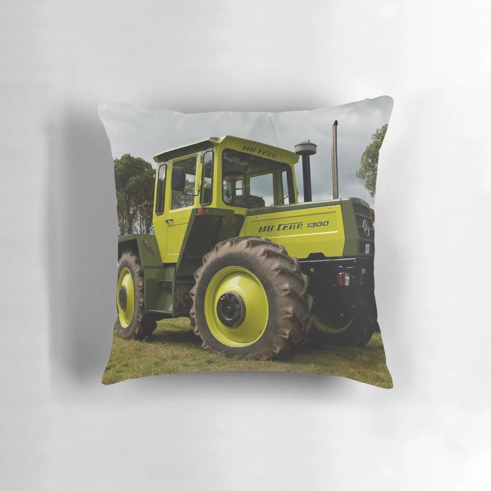 An image of a plush pillow featuring the iconic Mercedes-Benz MB-trac1300 tractor, perfect for farm and agriculture enthusiasts.