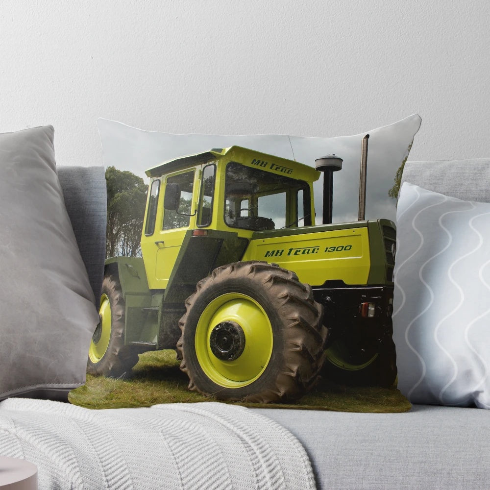 An image of a plush pillow featuring the iconic Mercedes-Benz MB-trac1300 tractor, perfect for farm and agriculture enthusiasts.