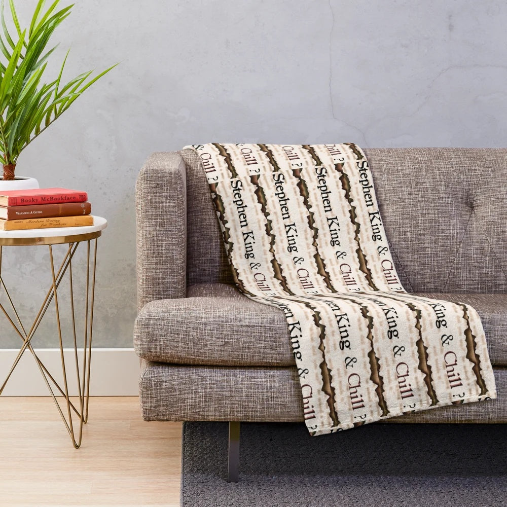 Plush blanket featuring a Stephen King-themed design