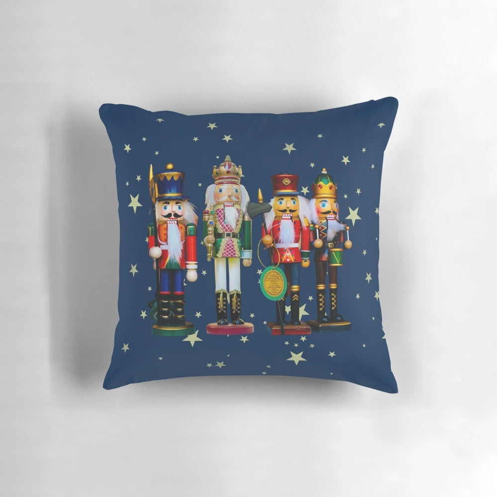 Festive holiday nutcracker figures and a cozy Christmas fireplace scene on a soft, plush pillow