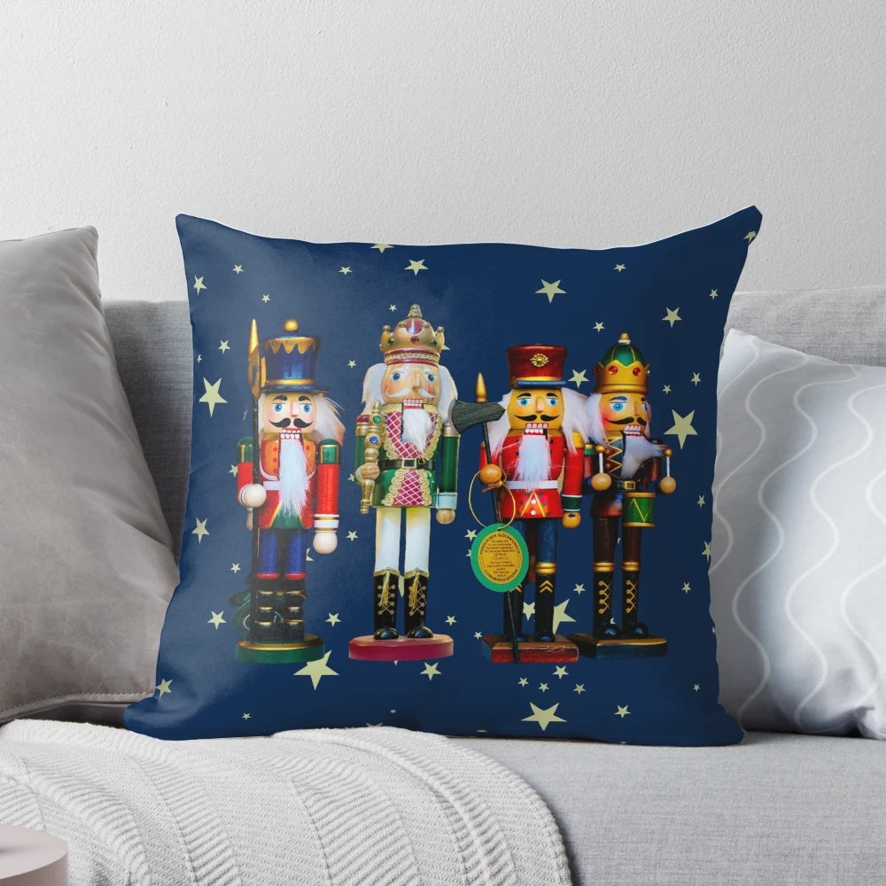 Festive holiday nutcracker figures and a cozy Christmas fireplace scene on a soft, plush pillow