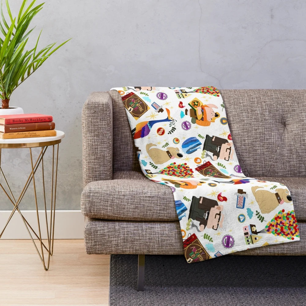 Plush blanket featuring characters and imagery from the Disney Pixar film "Up