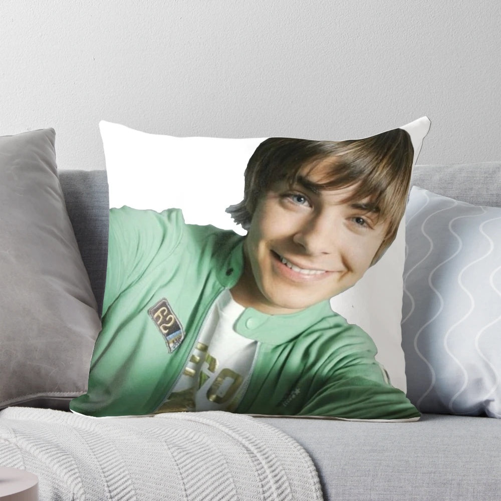 A plush pillow featuring a selfie of actor Zac Efron, known for his role as Troy Bolton in High School Musical.
