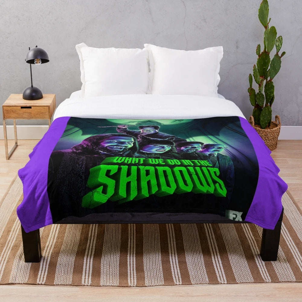 Plush blanket featuring characters from the TV show "What We Do in the Shadows