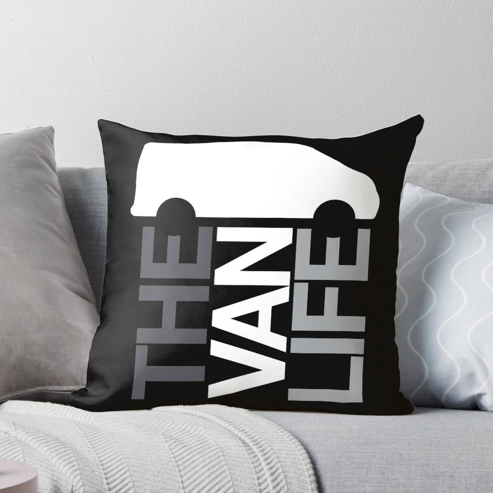 Greyscale graphic design pillow featuring a van life logo, perfect for van dwellers and outdoor enthusiasts.