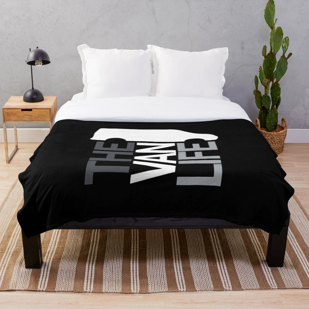Plush blanket with van life inspired greyscale design