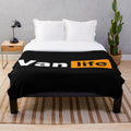 Plush black and orange blanket with van life graphics for outdoor enthusiasts