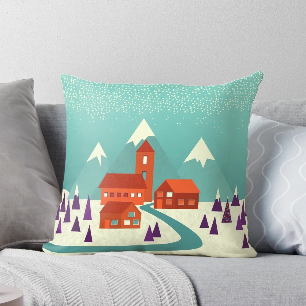 Cozy village landscape pillow in teal, purple, and orange hues with snowy houses and trees