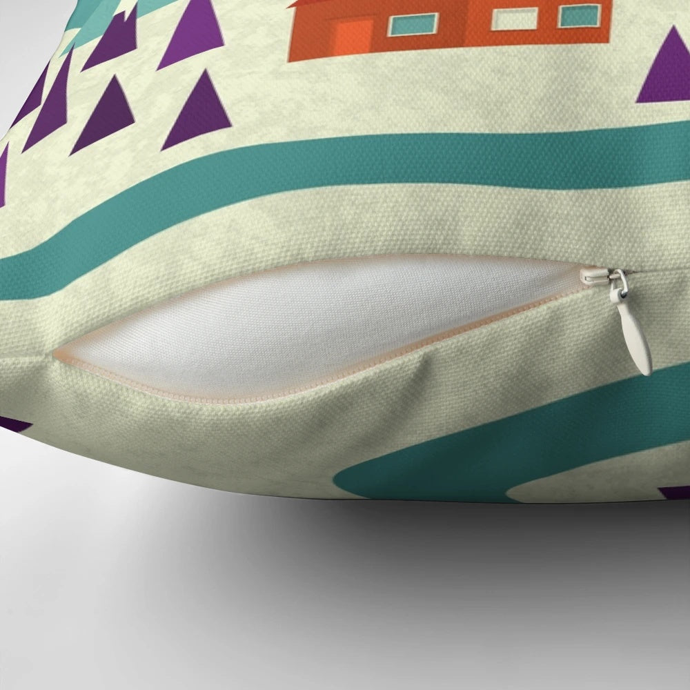 Cozy village landscape pillow in teal, purple, and orange hues with snowy houses and trees