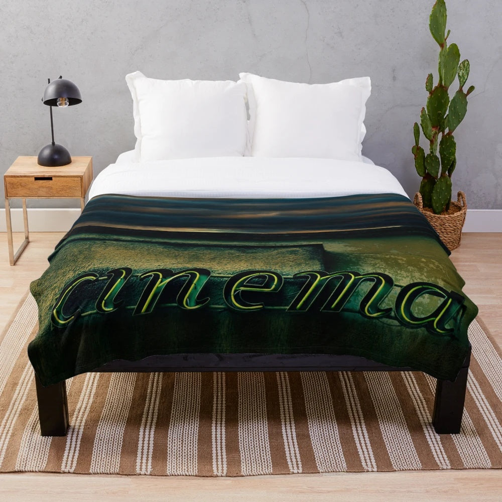 Vintage cinema-themed plush blanket with architectural and neon elements