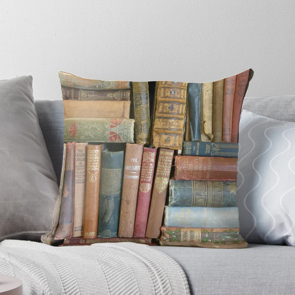 Vintage-style pillow featuring stacks of antique books and book spines in a cozy, rustic design