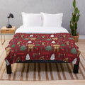 Vintage-style Christmas plush blanket with winter and holiday motifs