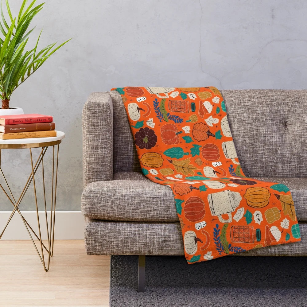 Vintage autumn-themed plush blanket with warm tones and seasonal leaf pattern