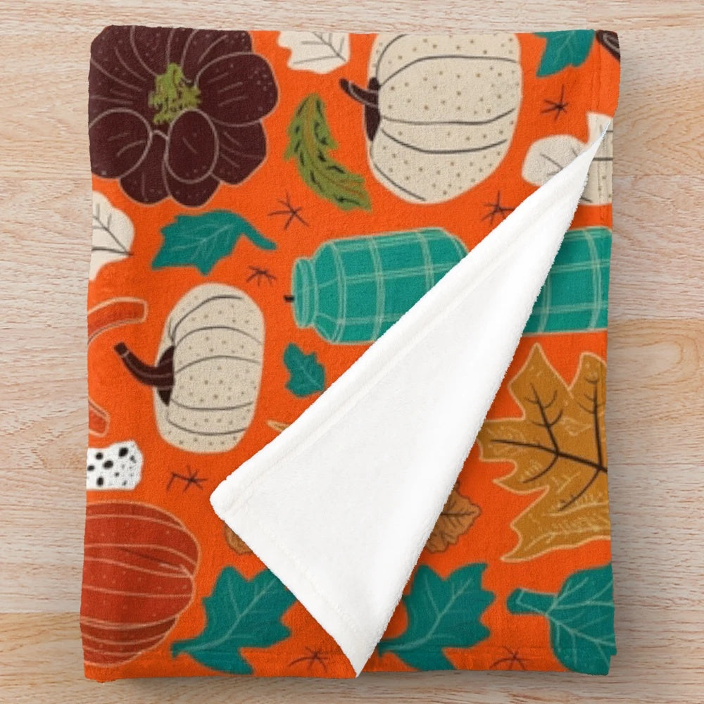 Vintage autumn-themed plush blanket with warm tones and seasonal leaf pattern