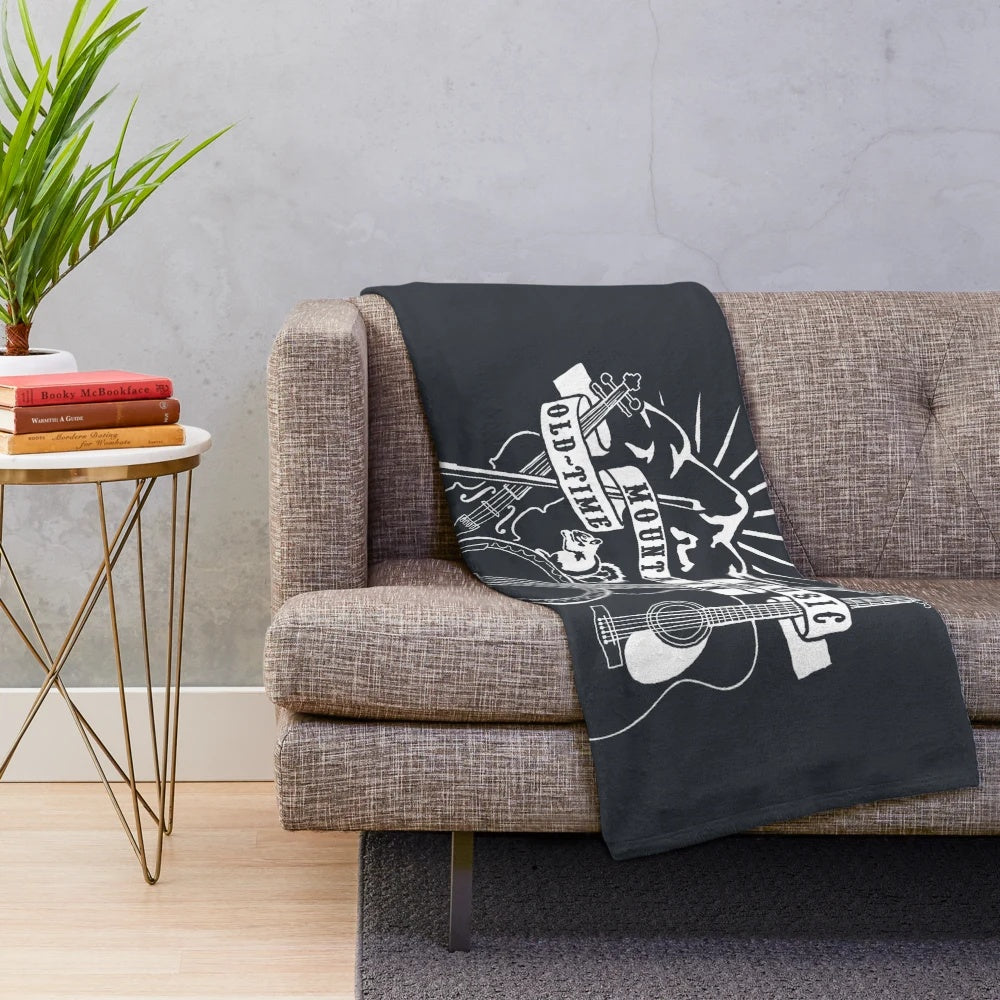 Vintage-inspired hand-drawn plush blanket featuring mountain music instruments like banjo, fiddle, and guitar
