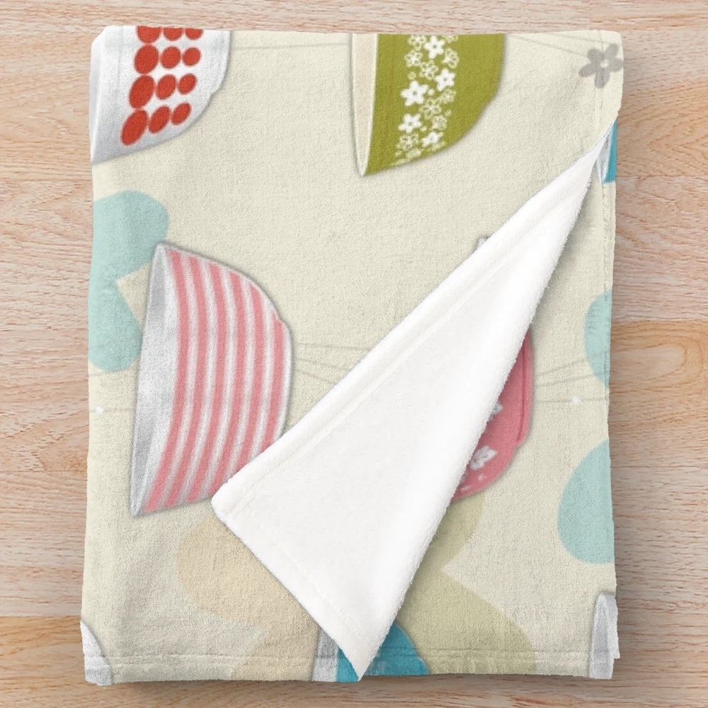 Vintage-inspired plush blanket featuring a collage of iconic Pyrex bowl designs