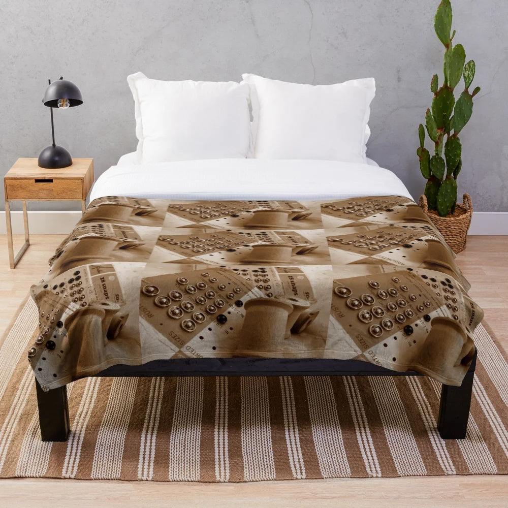 Vintage-inspired plush blanket with wooden spools and sepia tones