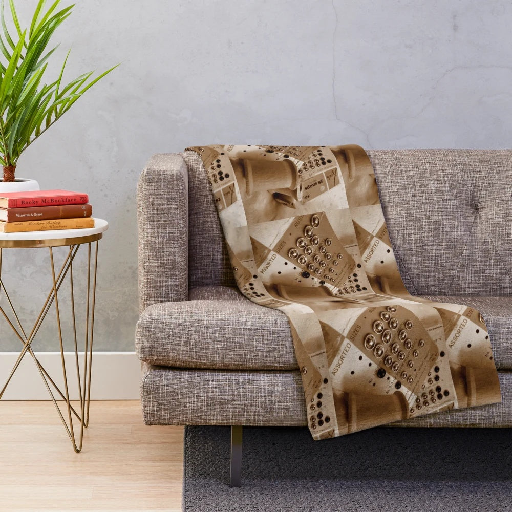 Vintage-inspired plush blanket with wooden spools and sepia tones