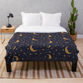 Vintage-style plush blanket with moon and stars design